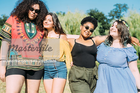 Friends posing in park