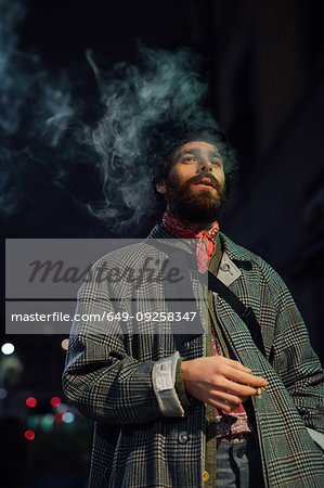 Bearded young man loitering on street