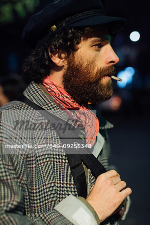 Bearded young man loitering on street