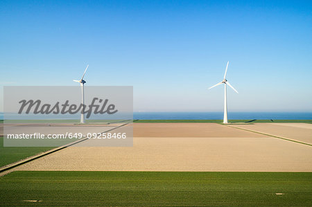 Coastal wind turbines and field landscape in spring, elevated view, Urk, Flevoland, Netherlands Coastal wind turbines and field landscape in spring, elevated view, Urk, Flevoland, Netherlands