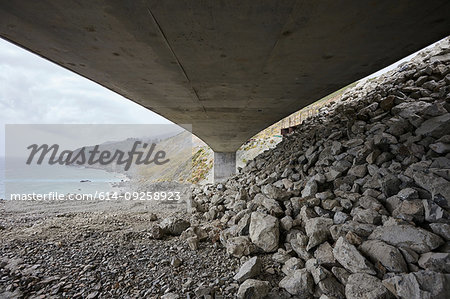 Landscape with concrete highway 1 flyover along coast, viewed below, Big Sur, California, USA