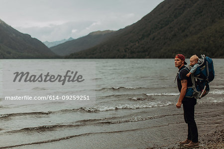 Father with baby on beach, Queenstown, Canterbury, New Zealand
