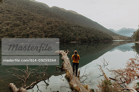 Woman enjoying scenic lake view, Queenstown, Canterbury, New Zealand