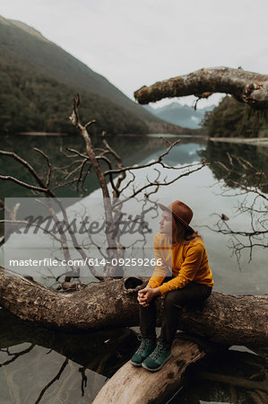 Woman enjoying scenic lake view, Queenstown, Canterbury, New Zealand