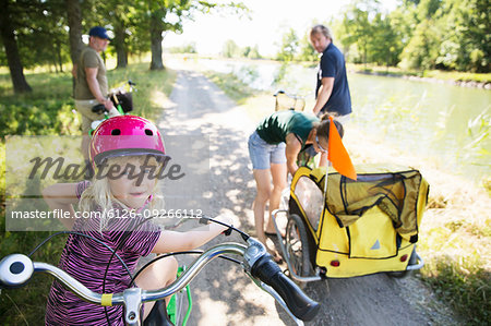 Family cycling by canal