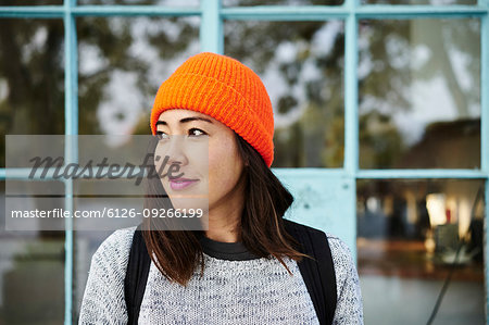 Young woman with orange beanie