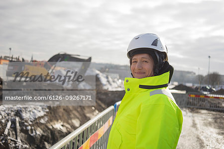 Smiling woman at construction site