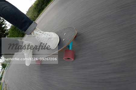 Feet of man skateboarding