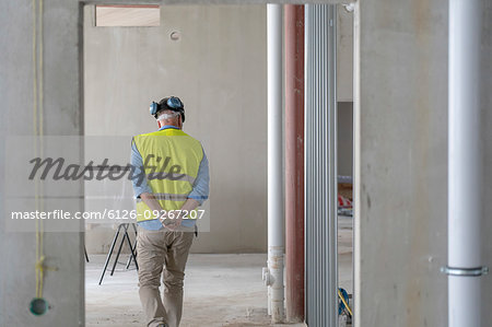 Construction worker in incomplete building