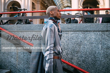 Stylish man going into subway station, Milan, Italy