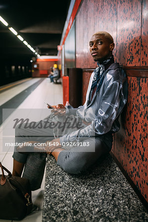 Stylish man on subway platform, Milan, Italy