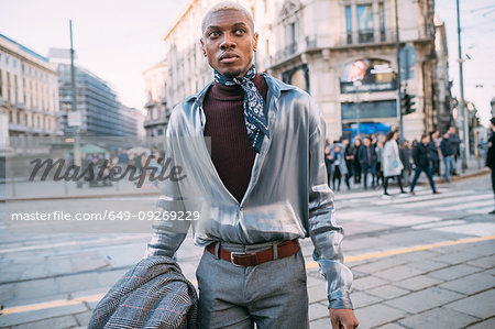 Stylish man walking in street, Milan, Italy