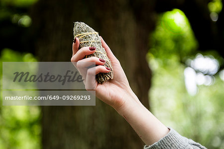 Woman holding healing stone for Reiki