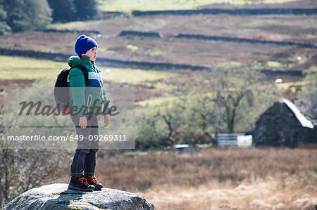 Boy exploring national park, Llanaber, Gwynedd, United Kingdom