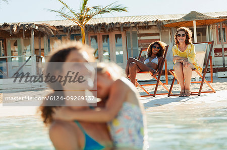 Happy women on sunny beach