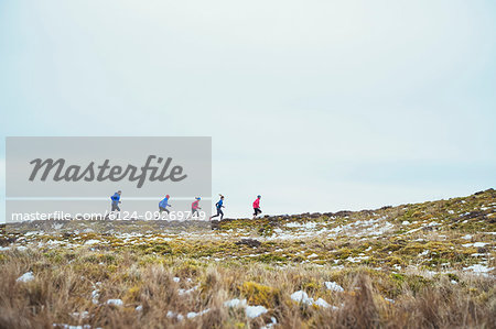 Friends jogging in snow