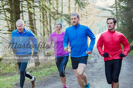 Family jogging in woods