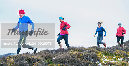 Friends jogging on trail