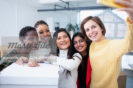 Happy businesswomen taking selfie