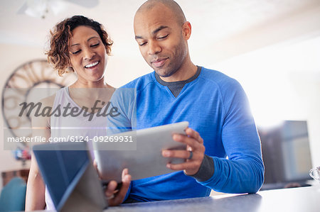 Couple using digital tablet