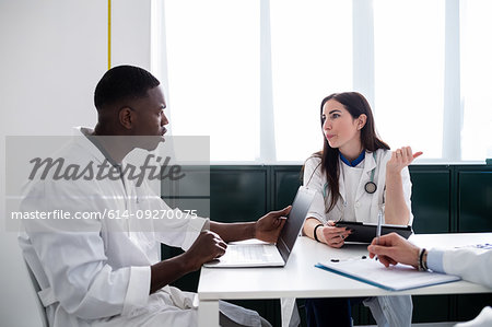 Doctors having discussion in meeting room