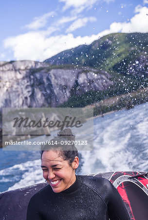 Woman travelling on speedboat, Squamish, Canada