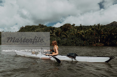 Woman kayaking, Princeville, Hawaii, US