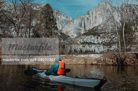 Man kayaking in lake, Yosemite Village, California, United States