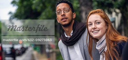 Couple waiting for taxi on street