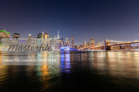 Manhattan skyline and Brooklyn Bridge at night