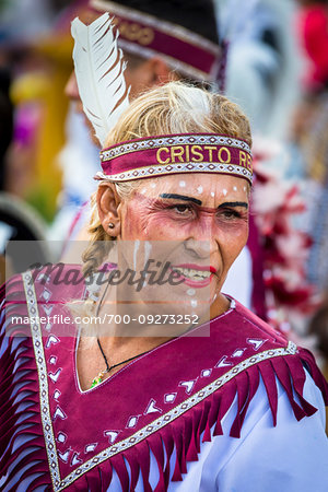 Close-up of a mature, female indigenous tribal dancer at a St Michael Archangel Festival parade in San Miguel de Allende, Mexico