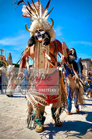 Indigenous tribal dancers at a St Michael Archangel Festival parade in San Miguel de Allende, Mexico