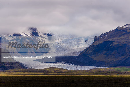 Snow capped mountain landscape with glacier and low cloud, Skaftafell, Austur-Skaftafellssysla, Iceland