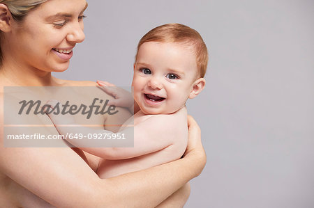Portrait of mother and laughing baby boy