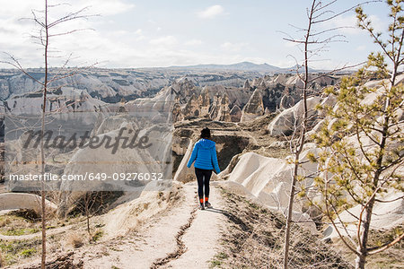 Woman hiking in rocky valley, Göreme, Cappadocia, Nevsehir, Turkey