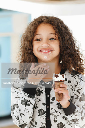 Girl eating ice cream at home
