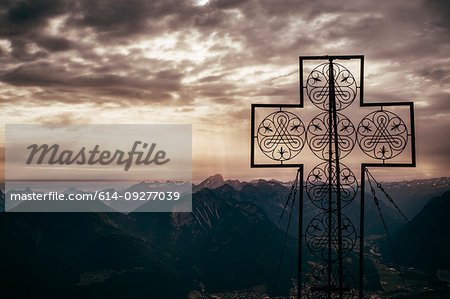 Large cross structure on peak, mountain ranges in background, Bludenz, Vorarlberg, Austria