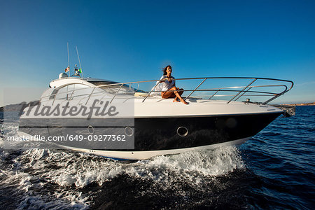 Woman relaxing on yacht