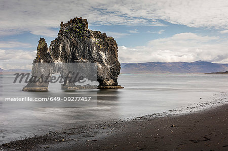 Volcanic rock formation in the shallows on a black sand beach, Hvitserkur, Nordurland Vestra, Iceland