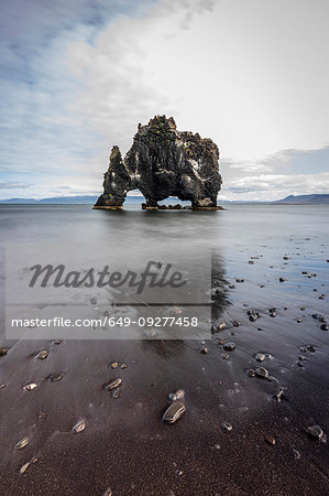 Volcanic rock formation in the shallows on a black sand beach, Hvitserkur, Nordurland Vestra, Iceland