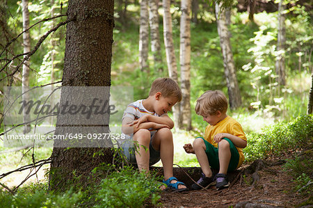 Brothers exploring forest, Finland