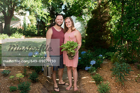 Couple gardening in backyard