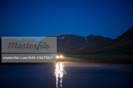 Off road vehicle in desert at night, Landmannalaugar, Highlands, Iceland