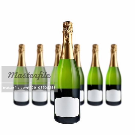 Champagne bottles with blank label for add text, over a white background. Focus at front