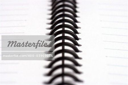 Close up of spiral note book, only focus on the center.