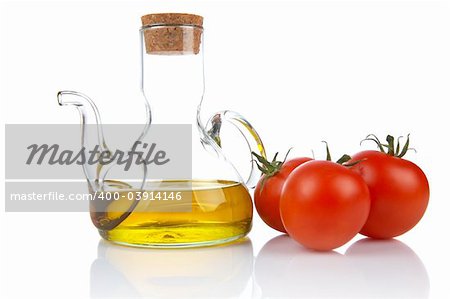 Tomatoes and extra virgin olive oil reflected on white background