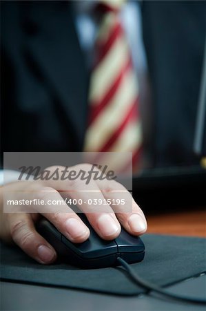 people at work: close-up of a businessman using a mouse