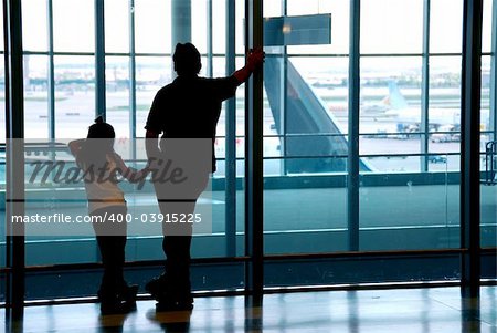 Family waiting at the international airport terminal