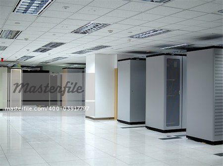 Interior shot of a large, partially empty datacenter.