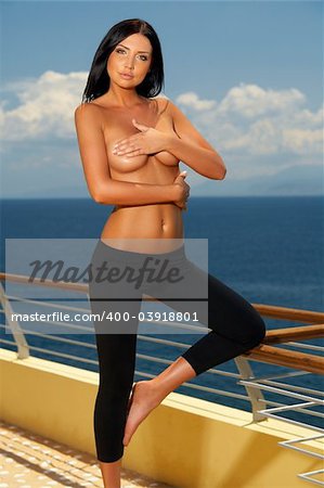 Beautiful young Sexy brunette woman posing in fitness wear